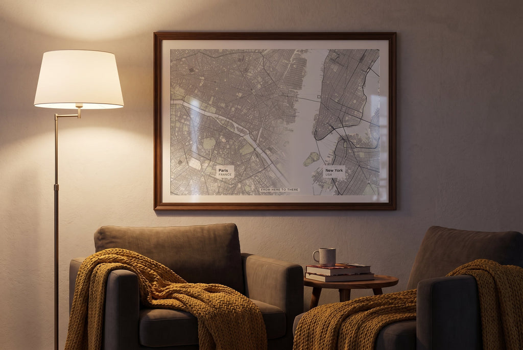 From Here To There personalised art print in a dark wood frame beside a cozy reading nook armchair